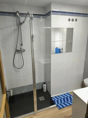 a shower with a glass door in a bathroom at Bet Apartments - Sunrise Beach Apartments in Valencia