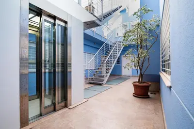 a hallway of an office building with a staircase at Bet Apartments - Sunrise Beach Apartments in Valencia