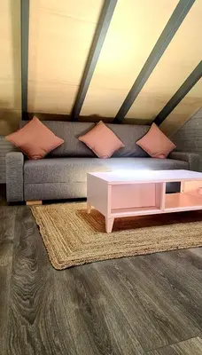 a living room with a couch and a coffee table at Loft independiente con Piscina compartida en Centro de Valencia in Valencia
