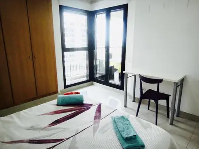 a room with a desk and a table and a chair at Patacona Beach Power!! in Valencia