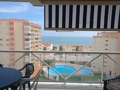 a view of the beach from a hotel balcony at Mar Azul Solo Familias Serviplaya in Casas Las Basas