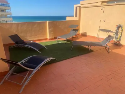 a group of chairs sitting on top of a roof at Los Naranjos Solo Familias in Casas Las Basas