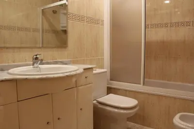 a bathroom with a sink and a toilet and a shower at Los Naranjos Solo Familias in Casas Las Basas