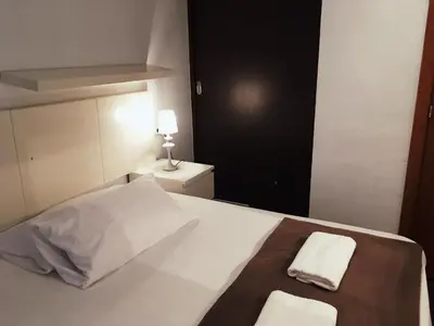 a bedroom with a bed with two towels on it at Ayuntamiento Silence in Valencia