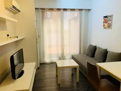 a small living room with a couch and a tv at Ayuntamiento Silence in Valencia