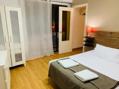 a bedroom with a bed with two towels on it at Ayuntamiento Silence in Valencia