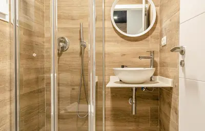 a bathroom with a sink and a shower at New Room in the beach in Valencia