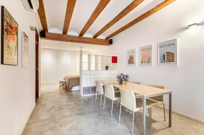 a dining room with a table and chairs at Loft Mercado Mossen Sorell in Valencia