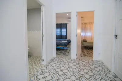 a hallway with a room with a bed and a bathroom at Cozy Flat in City Center Feel the Vibe SelfCheckIn in Valencia