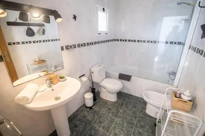 a bathroom with a sink and a toilet and a shower at Tranquilo y acogedor en el centro de la ciudad in Valencia