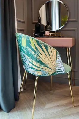 a chair in front of a desk with a mirror at Reina 107 Beach Boutique in Valencia
