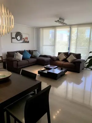 a living room with a couch and a table at Art and Sciences view luxury apartment in Valencia