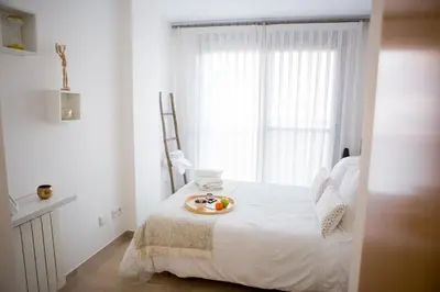 a bedroom with a bed with a plate of fruit on it at Art and Sciences view luxury apartment in Valencia
