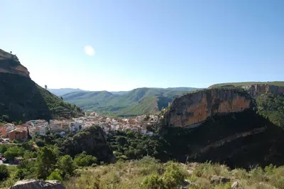 a view of a town in the mountains at APARTAMENTOS GALLACH (LA ERMITA) in Chulilla