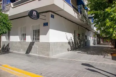 a white building with a sign on the side of it at Soraya's Place - Chopín 3 in Valencia