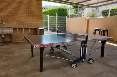 a ping pong table in a parking lot at Apartamento nuevo playa de Canet de Berenguer WIFI in Canet de Berenguer