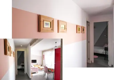 a living room and a dining room with white walls at Torres de Serrano Apartment in Valencia