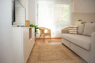 a living room with a couch and a table at Soraya's Place - Chopín 5 in Valencia