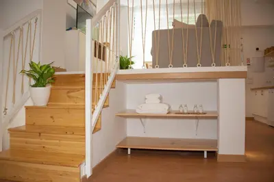 a staircase in a house with a shelf under it at Soraya's Place - Chopín 5 in Valencia