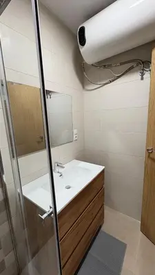 a bathroom with a sink and a mirror at Piso cerca de la playa - Act. Mauri 1B in Valencia