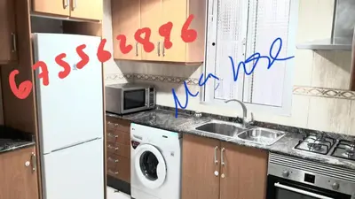 a kitchen with a sink and a washing machine at Alquiler Universidades Malvarrosa Playa Maritim Valencia Solo para familias con niños in Valencia
