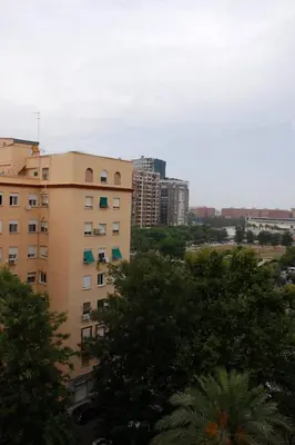 a view of a building in a city with trees at apartemento ideal grupo y familia climatisacion y cerca playa . mongrell in Valencia
