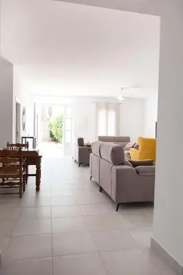 a living room with a couch and a table at Villa Conchin Casa junto a Parque Natural in Alberique