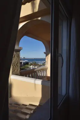 a view of a balcony with a view of the ocean at Beach House Villa Roca in Cullera
