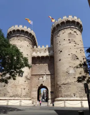 a large castle with an archway in front of it at Beach House Villa Roca in Cullera