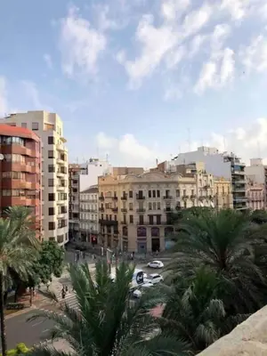 a view of a city with buildings and palm trees at Precioso atico en pleno centro de Valencia in Valencia