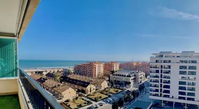 a view of a city from the balcony of a building at NON STRESS Ático Dúplex con vistas al MAR in Valencia