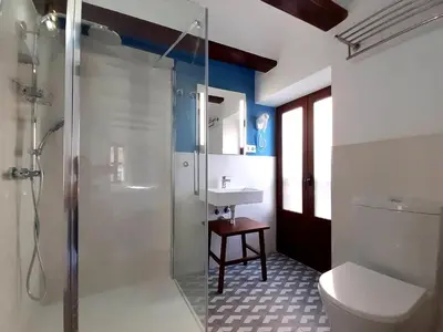a bathroom with a shower and a toilet and a sink at Hotel 19-30 Valencia in Valencia