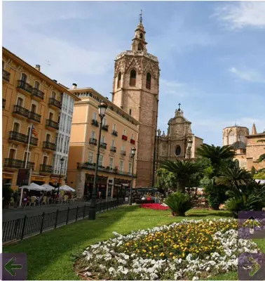 a large building with a clock tower in a city at Fantástico Loft en centro ciudad planta baja in Valencia