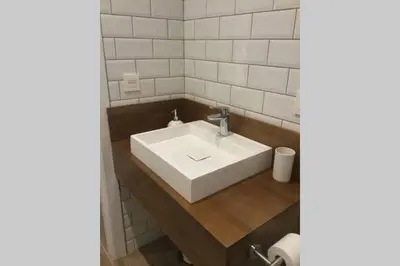 a bathroom with a white sink and a mirror at Fantástico Loft en centro ciudad planta baja in Valencia