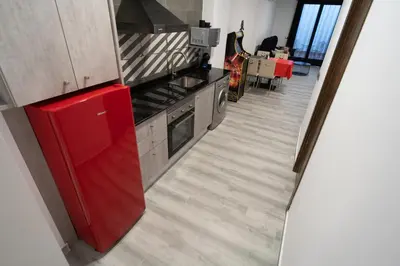 a kitchen with a red refrigerator and a dining room at Star Anna in Anna
