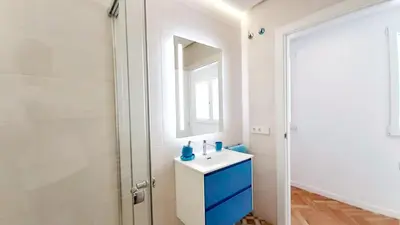 a bathroom with a sink and a mirror at Valencia Town Hall Dream in Valencia