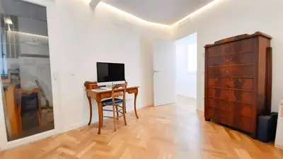 a room with a desk and a computer on a table at Valencia Town Hall Dream in Valencia