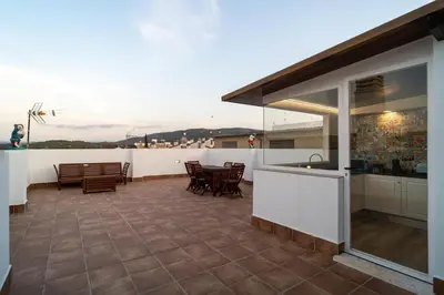 a patio with chairs and a table on a balcony at Bellanna - Panorámica in Anna