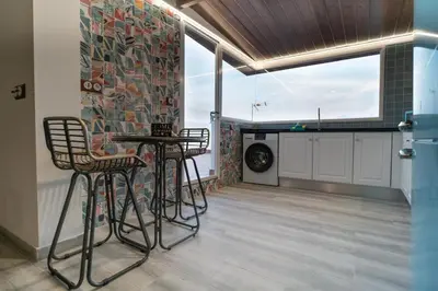 a kitchen with two chairs and a table in a room at Bellanna - Panorámica in Anna