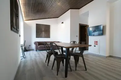 a dining room with a wooden table and chairs at Bellanna - Panorámica in Anna