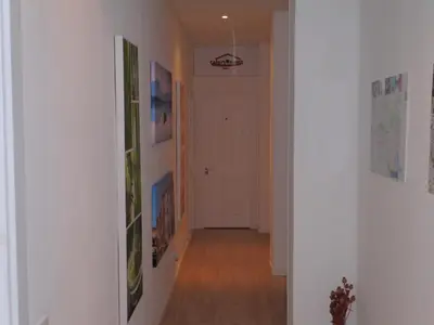 a hallway with white walls and a white door at Colors Rooms in Valencia