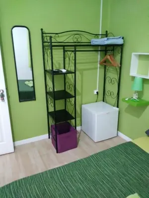 a bedroom with a bunk bed with a mirror at Colors Rooms in Valencia