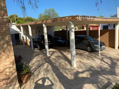 a garage with a car parked under it at Maravisa in Puebla de Vallbona