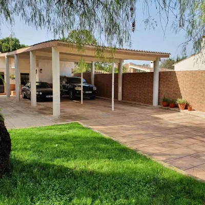 a garage with a car parked in it at Maravisa in Puebla de Vallbona
