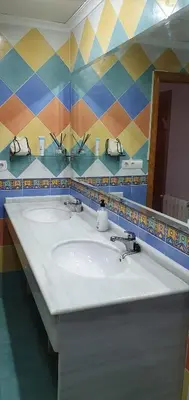 a bathroom with two sinks and a mirror at Maravisa in Puebla de Vallbona