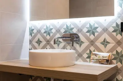 a white sink on a wooden counter in a bathroom at ART LOFTS Valencia by Benisur in Valencia