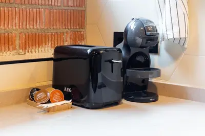 a coffee maker sitting on top of a counter at ART LOFTS Valencia by Benisur in Valencia