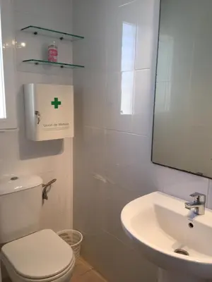 a bathroom with a white toilet and a sink at Ideal house at the Beach in Sagunto(Valencia) in Sagunto