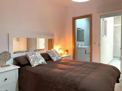 a bedroom with a large bed with two pillows on it at UIM Mediterraneo PB Aragon A Wifi in Puerto de Sagunto