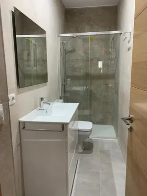 a bathroom with a toilet and a sink and a shower at UIM Mediterraneo PB Aragon A Wifi in Puerto de Sagunto